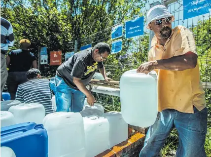  ?? Getty Images ?? Cape Town residents are getting used to queuing for water.