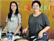  ?? Picture: EUGENE COETZEE ?? YUMMY ON THE WAY: Mother and daughter Cassidy, left, and Mary Anne Chantson whip up a meal at the Chinese food market held at the Chinese Community Centre in Yokohama Streets in Morningsid­e on Sunday