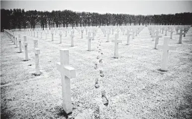  ?? VIRGINIA MAYO/AP ?? Snow falls at an American World War I cemetery in Romagne-Sous-Montfaucon, France.