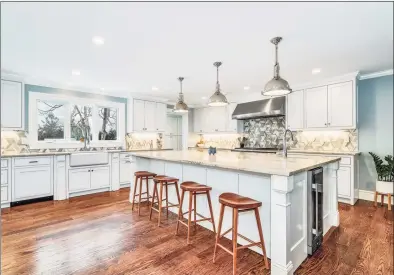  ??  ?? Address: 18 Tommys Lane, New Canaan 2,395,000
12
Spacious and luxurious primary suite with dual walk-in closets and sitting area; plenty of natural light; fine architectu­ral details.
Schools: South Elementary, Saxe Middle, and New Canaan High School
