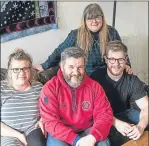  ??  ?? Jonathan Dennis, centre, at home with his daughter Rachael, left, son Alasdair, right, and wife Kerry