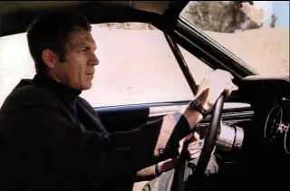  ??  ?? Below The man himself behind the wheel in the movie. McQueen would subsequent­ly try to buy back the Bullitt Mustang, but it has remained in one-family ownership since 1974.