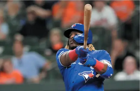  ?? AP PHOTO ?? Toronto Blue Jays’ Vladimir Guerrero Jr. watches his solo home run off Baltimore Orioles relief pitcher Dillon Tate during the eight inning of a game Thursday in Baltimore. The Blue Jays won 11-2.