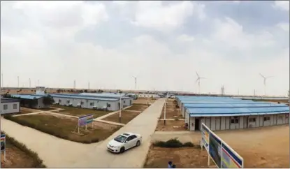  ?? XINHUA ?? Archived photo shows the second and third wind farms developed and constructe­d by China Three Gorges Corp in Pakistan’s Sindh province. The company has been stepping up its clean energy portfolio abroad, engaging in more wind and solar projects.