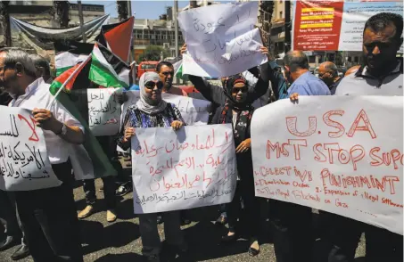  ?? Abbas Momani / AFP / Getty Images ?? Palestinia­ns protest the arrival of Jared Kushner, who met with President Mahmoud Abbas in the West Bank city of Ramallah.