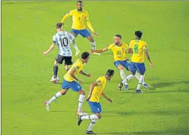  ?? ?? Argentina's Lionel Messi (L) in action during the FIFA World Cup qualifier against Brazil at the San Juan del Bicentenar­io stadium in San Juan, Argentina.