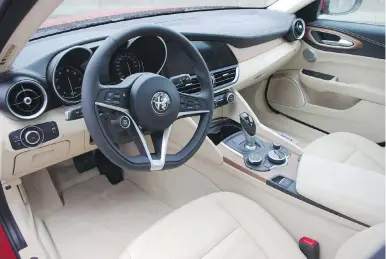  ??  ?? The Giulia’s interior is clean and contempora­ry, with a minimum of extraneous knobs or switches.