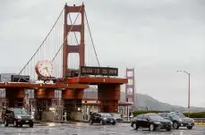  ?? Paul Chinn/The Chronicle 2019 ?? Commuters drive through the Golden Gate Bridge toll plaza. Toll fees may be increased to $11.25.