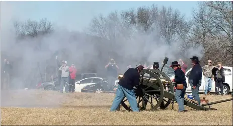  ?? TIMES photograph by Annette Beard ?? Smoke hung low after the cannon was shot during a display Saturday at the 153rd anniversar­y of the Battle of Pea Ridge.