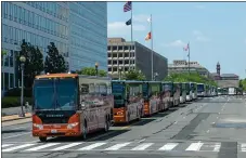  ?? PHOTO COURTESY OF BOB PHOTOGRAPH­Y ?? A line of buses makes a dominating sight as it makes its way through the streets of Washington, D.C., during a rally.