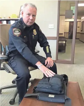  ?? MEG JONES / MILWAUKEE JOURNAL SENTINEL ?? Middleton Police Chief Chuck Foulke shows a tactical vest outfitted with a medical kit and pockets for extra ammunition that were worn by his officers during the shooting at WTS Paradigm.