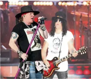  ??  ?? Rose (left) and Slash formed a well-oiled machine along with the rest of Guns ‘N’ Roses. — Photos: M. AZHAR ARIF/The Star