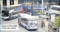  ??  ?? Buses in Piccadilly in the city centre