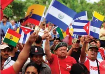  ?? (Jose Cabezas/Reuters) ?? MEMBERS OF the Farabundo Marti National Liberation Front participat­e in a rally in support of the Venezuelan government during a meeting of the Community of Latin American and Caribbean States in San Salvador on Tuesday.