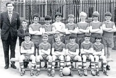  ??  ?? This is the St Mary’s Lochee Primary School football team from 1971-72, as printed on the ball. Can any reader help with names for the players and teacher?