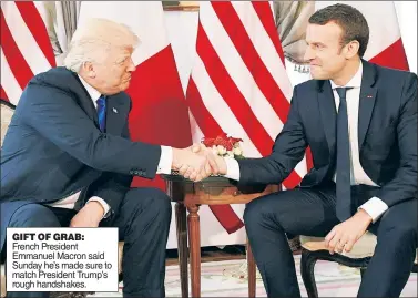  ??  ?? GIFT OF GRAB: French President Emmanuel Macron said Sunday he’s made sure to match President Trump’s rough handshakes.