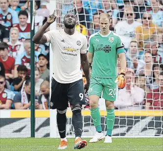  ?? MARTIN RICKETT THE ASSOCIATED PRESS ?? Manchester United’s Romelu Lukaku celebrates after scoring in Premier League soccer in Burnley, England, on Sunday. Lukaku scored both goals in a 2-0 Manchester United victory.