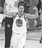  ?? CARY ?? Warriors guard Klay Thompson reacts after making a 3-pointer against the Rockets on Saturday.