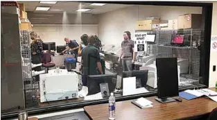  ?? ALEX HORVATH / THE CALIFORNIA­N ?? In this file photo, county employees work in the counting machines room at the Kern County Election Office.