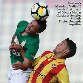  ??  ?? Floriana's Maurizio Vella (L) heads first ahead of Nicola Matias Garcia of Senglea Athletic Photo: Domenic Aquilina