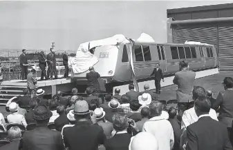  ?? Bill Young / The Chronicle 1965 ?? Bay Area Rapid Transit officials unveil BART’s first model car, which toured around the Bay Area in 1965. Those railcars, with their classic slanted nose design, are being phased out.