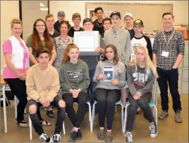  ?? ANDREA PEACOCK/Courier ?? Mount Boucherie Secondary teacher Barb Butler, left, poses with her Social Studies 10 class after students voted in a mock provincial election as part of the Elections BC Student Vote program.