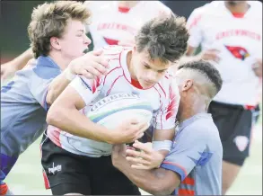  ?? Bob Luckey Jr. / Hearst Connecticu­t Media ?? Greenwich’s Francisco Liguori, center, in action as Fairfield Co-op’s Mike White, left, goes for the tackle during the rugby state semifinals on May 24, 2017.