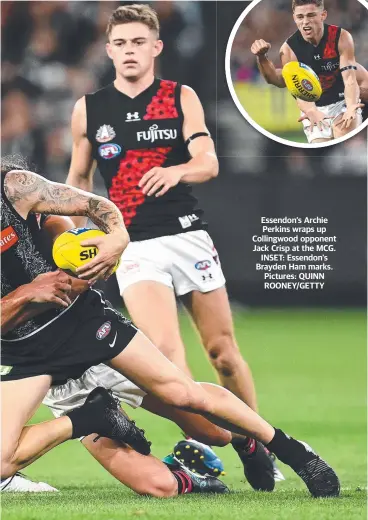  ??  ?? Essendon’s Archie Perkins wraps up Collingwoo­d opponent Jack Crisp at the MCG. INSET: Essendon’s Brayden Ham marks. Pictures: QUINN ROONEY/GETTY