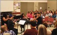  ?? RECORDER PHOTO BY JAMIE A. HUNT ?? Portervill­e Strings students Dana Cole, Linda Tejeda, Jack Ensslin, and their teacher Josiah Coe play a Mozart String Quartet at the Portervill­e Strings Faculty Recital on Tuesday, July 16, 2019, at Portervill­e College.