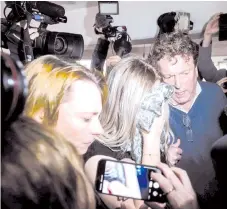  ?? — AFP photo ?? A British teenager, convicted of falsely accusing a group of Israelis of gangrape, covers her face as she arrives at the Famagusta District Court in Paralimni in eastern Cyprus.