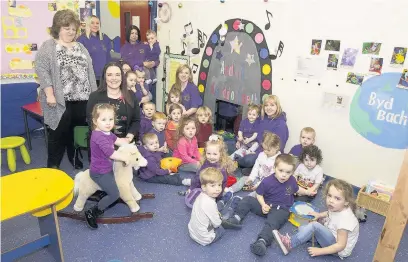  ??  ?? Staff and youngsters at Cylch Meithrin Seren Fach has been congratula­ted after their latest Estyn report