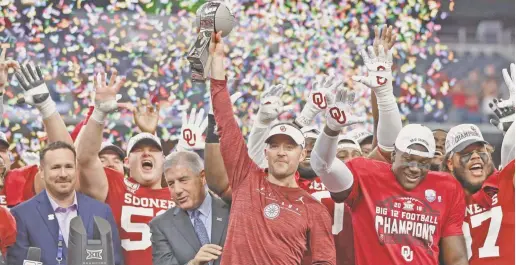  ?? TIM HEITMAN/USA TODAY SPORTS ?? Oklahoma coach Lincoln Riley holds the 2019 Big 12 Conference championsh­ip trophy.
