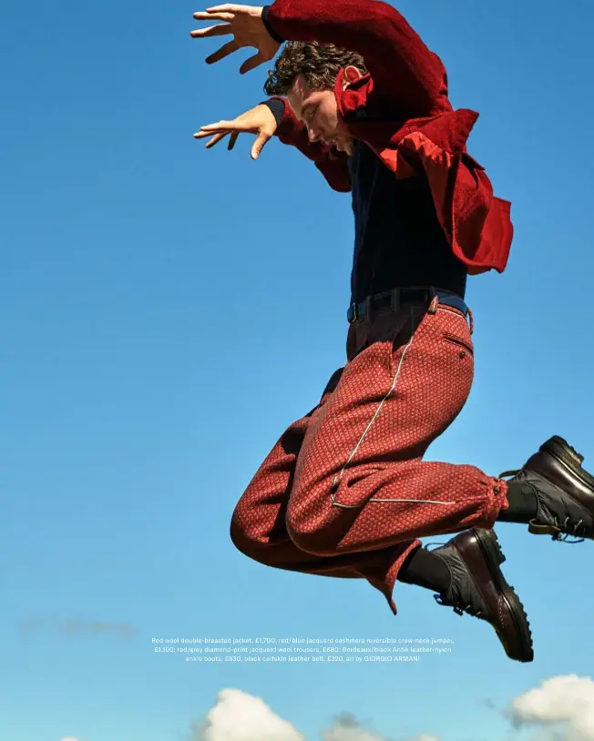  ??  ?? Red wool double-breasted jacket, £1,700; red/blue jacquard cashmere reversible crew-neck jumper, £1,100; red/grey diamond-print jacquard wool trousers, £680; Bordeaux/black Antik leather-nylon
ankle boots, £630; black calfskin leather belt, £320, all by GIORGIO ARMANI