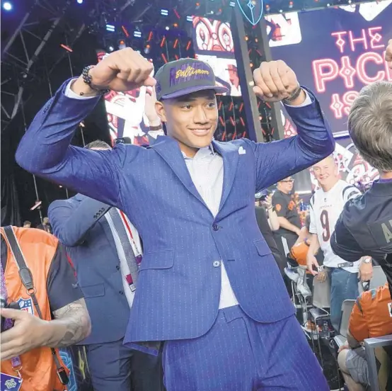  ?? JAE C. HONG/AP ?? Notre Dame safety Kyle Hamilton celebrates with fans after being chosen by the Ravens with the 14th pick of the NFL draft on Thursday in Las Vegas.