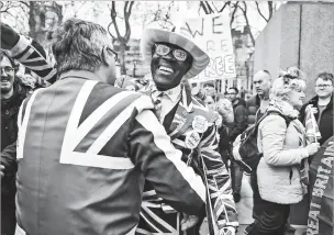  ?? MARY TURNER/NEW YORK TIMES ?? Supporters of Brexit celebrated in Parliament Square in London on Friday as Britain left the EU.