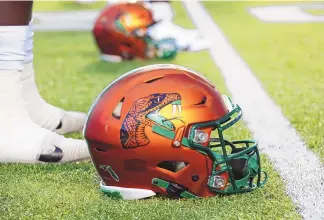  ?? CHRIS SEWARD/ASSOCIATED PRESS ?? A Florida A&M helmet sports the Rattlers logo before a game against North Carolina in Chapel Hill, N.C., on Aug. 27, 2022. Florida A&M has banned its players from the team’s facilities after a rap video featuring some Rattlers was shot in their locker room without proper permission being granted.