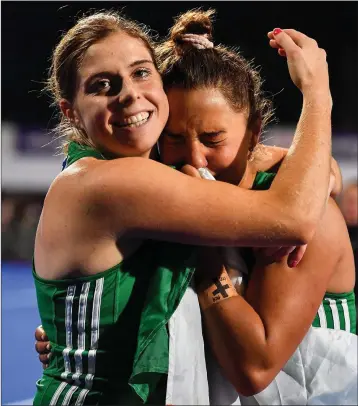  ??  ?? Ireland captain Katie Mullan, left, and Glenealy’s Lena Tice of Ireland celebrate after qualifying for the Tokyo2020 Olympic Games during after the FIH Women’s Olympic Qualifier match between Ireland and Canada at Energia Park in Dublin.