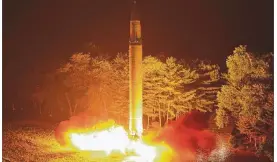  ?? KOREAN CENTRAL NEWS AGENCY / KOREA NEWS SERVICE ?? The North Korean government claims this photograph shows the launch of a Hwasong-14 interconti­nental ballistic missile in July. North Korea launched a missile over Japan in its longest-ever flight Friday as leader Kim Jong Un defiantly pushes to...