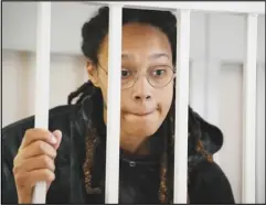  ?? Associated Press ?? WNBA star and two-time Olympic gold medalist Brittney Griner stands in a cage at a court room prior to a hearing, Tuesday, in Khimki just outside Moscow, Russia. Griner has returned to a Russian courtroom for her drawn-out trial on drug charges that could bring her 10 years in prison if convicted.