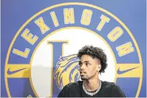  ?? SAM WOLFE Special To The State ?? Basketball player Cam Scott speaks during an interview following a signing ceremony at Lexington High School in Lexington on Wednesday.