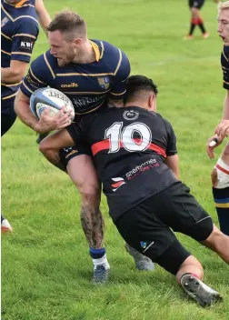  ??  ?? A Saracens man is tackled during their defeat to Cheltenham North