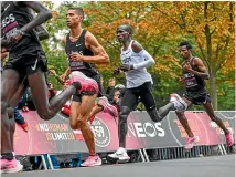  ?? AP ?? Eliud Kipchoge, second from right, wore Nike ZoomX Vaporfly shoes when he broke the twohour marathon barrier.