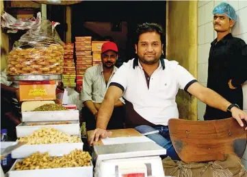  ?? — WP-Bloomberg photos ?? Gupta says sales in his sweets shop have slowed for the first time since he took it over seven years ago.