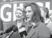  ?? AL GOLDIS/AP ?? Michigan Democratic candidate Gretchen Whitmer, right, answers questions after casting her ballot in East Lansing.