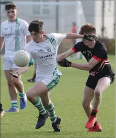  ??  ?? Luke Kavanagh of St. Peter’s tries to shake off Lee Pearson (St. Mary’s).