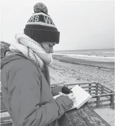  ?? CONTRIBUTE­D ?? University of Windsor student Summer Locknick takes notes of where rip currents form, as well are where safety signs are located, while at Cavendish Beach last November. Locknick, a master of earth Science student, will be spending July in P.E.I. to research the connection between beachgoer behaviour and rip current hazards.