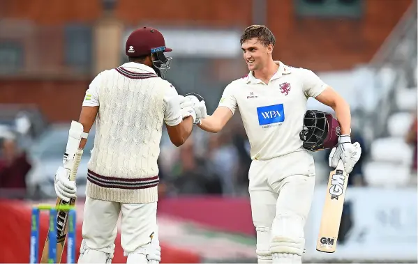  ?? PICTURE: Harry Trump/getty Images ?? Somerset’s Tom Lammonby celebrates his century with Azhar Ali during another disappoint­ing big defeat against Lancashire in the County Championsh­ip