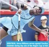  ??  ?? MONTREAL: Venus Williams serves against Caroline Dolehide during day one of the Rogers Cup at IGA Stadium on August 6, 2018. — AFP