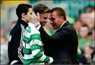  ??  ?? Happy in Hoops... Patrick Roberts (left) will stay on and play for Brendan Rodgers’ side in the Scottish Cup final