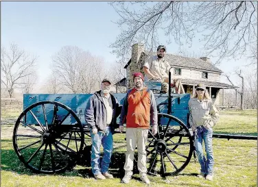  ?? (Courtesy Photo) ?? Johnny Durossette (from left), Josh Owens, Dom Lockman and Carla Parker, maintenanc­e staff with Prairie Grove Battlefiel­d State Park, fully restored the Springfiel­d wagon at the park. The wagon is near the Latta House.